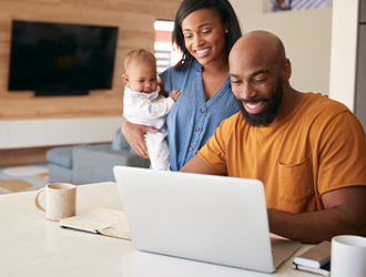 Couple checking computer