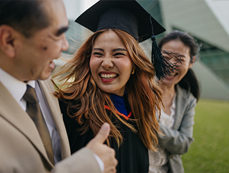 Graduate celebrating with family
