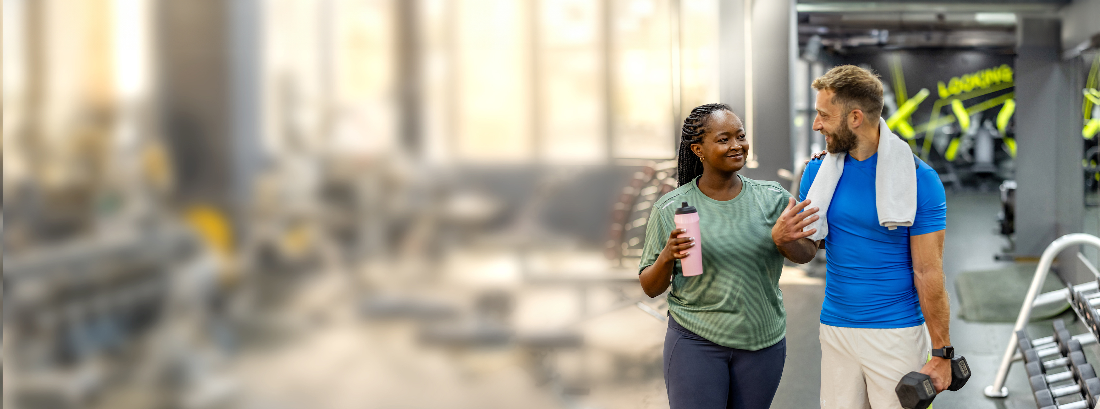 Two people about to workout at the gym